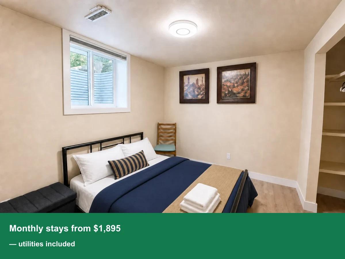 AI-enhanced photo of the main bedroom in the Huntington Hills walkout suite
