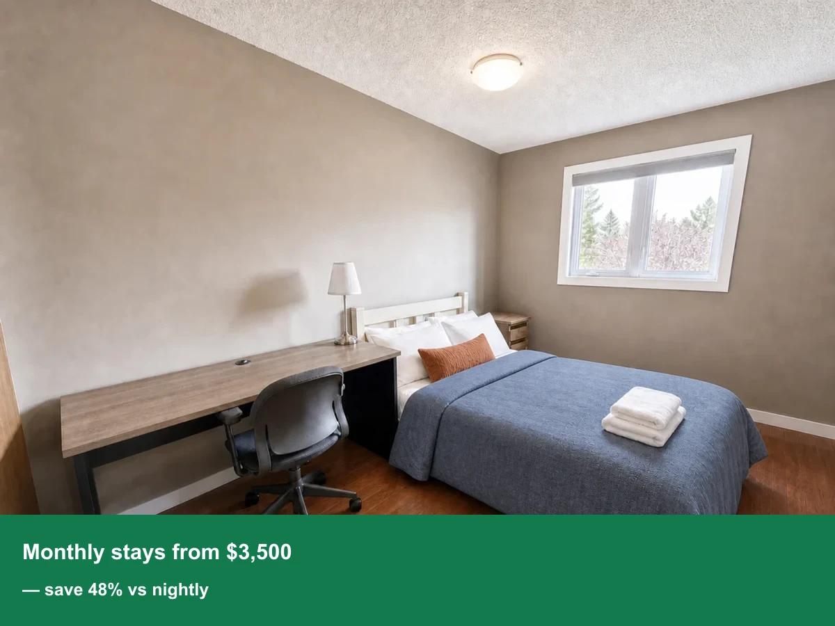 AI-enhanced photo of the queen bedroom and workspace in the Sandstone four-bedroom home
